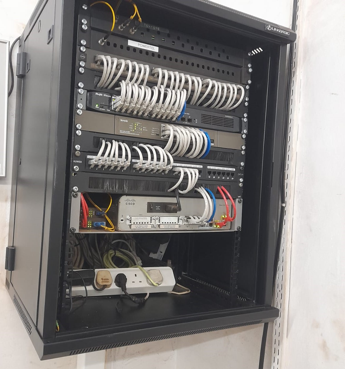Neatly organised and labelled server cabinet after NITS cabling work